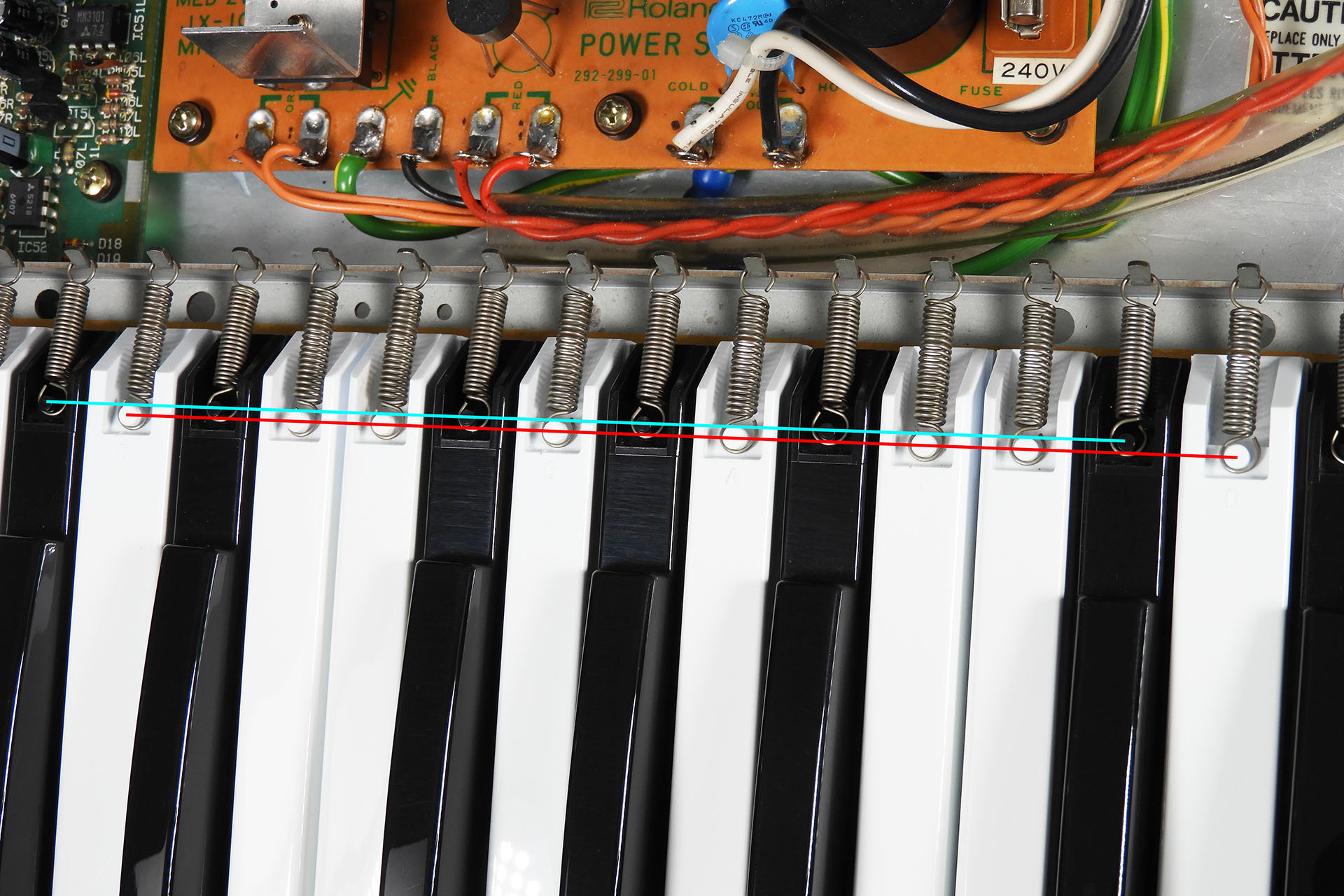 Black and white keys have different length key tension springs on the Roland JX-10